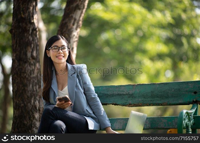 Young business women are enjoying outdoor office work, business success concept