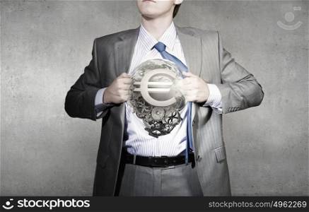 Young businessman acting like super hero of creativity. Businessman and idea