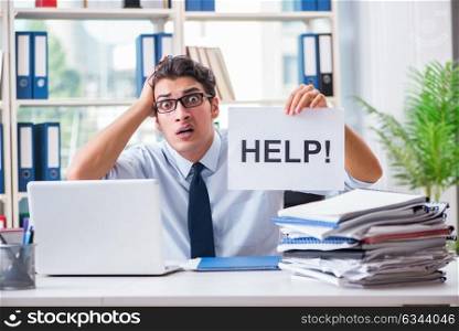 Young businessman asking for help in office