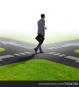 Young businessman at crossroads in uncertainty concept. The young businessman at crossroads in uncertainty concept
