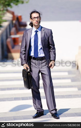 Young businessman at the street scene