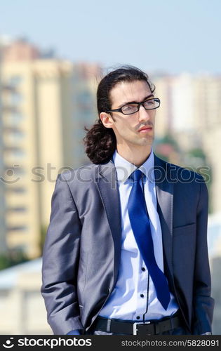 Young businessman at the street scene