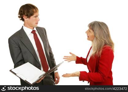 Young businessman being confronted by his angry female boss. Isolated on white.