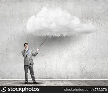 Young businessman caught white cloud with lead. Do not let the idea to leave you