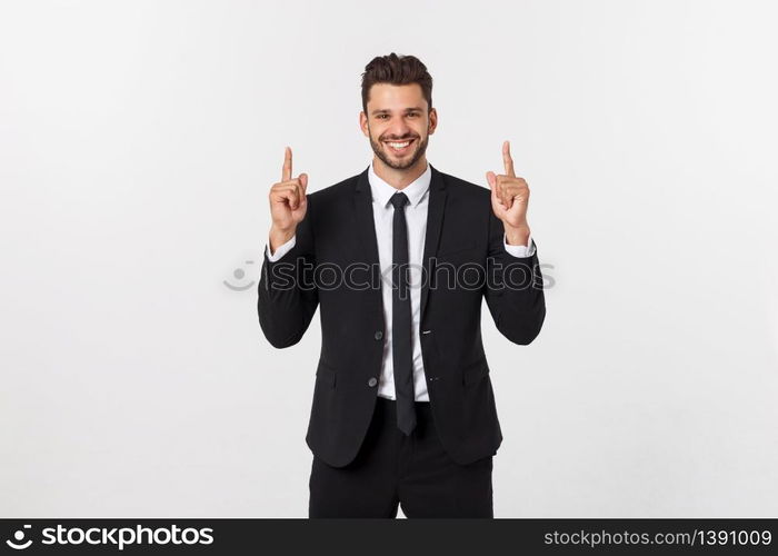 Young businessman celebrating his success over gray background. Young businessman celebrating his success over gray background.