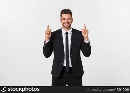Young businessman celebrating his success over gray background. Young businessman celebrating his success over gray background.
