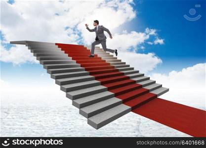Young businessman climbing stairs and red carpet into sky