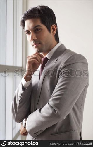 Young businessman contemplating