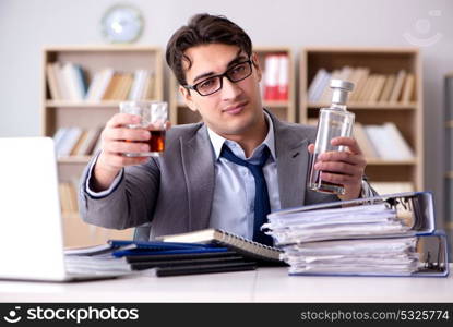 Young businessman drinking from stress