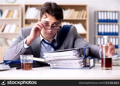 Young businessman drinking from stress