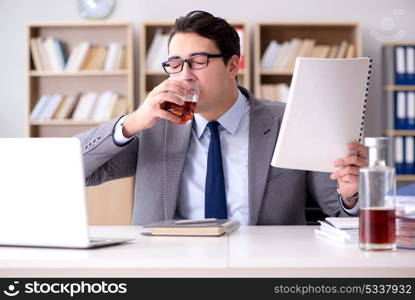 Young businessman drinking from stress