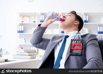 Young businessman exercising with elastic expander in office