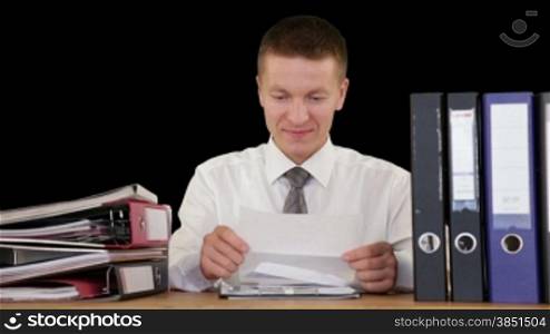 Young Businessman getting fired through a letter, against black