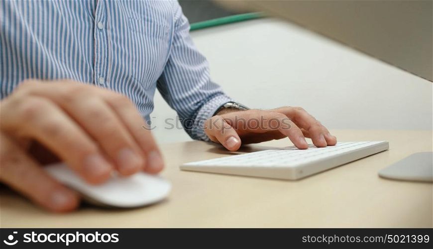 Young Businessman Hands Typing On Computer Keyboard in startup office