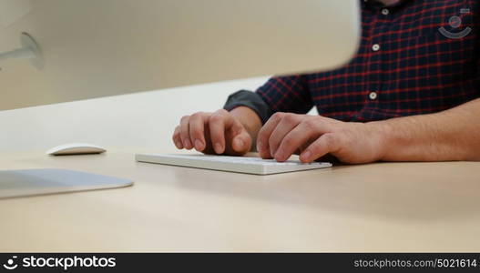 Young Businessman Hands Typing On Computer Keyboard in startup office