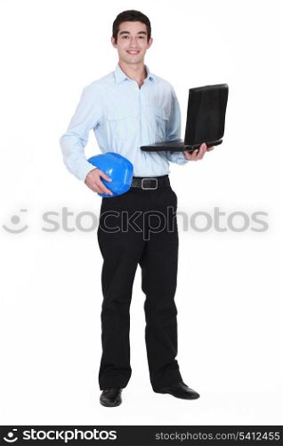 young businessman holding a helmet and a laptop