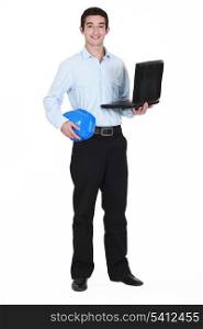 young businessman holding a helmet and a laptop