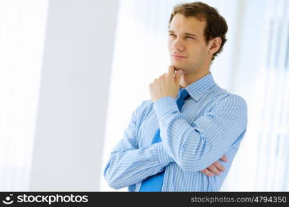 Young businessman. Image of young handsome confident businessman in suit