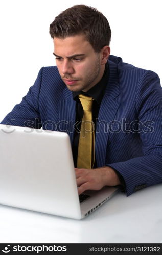 Young Businessman in a Blue suit Working on He&rsquo;s Notebook