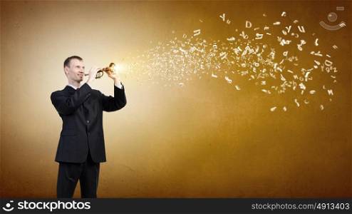 Young businessman in black suit playing flute. Businessman playing flute