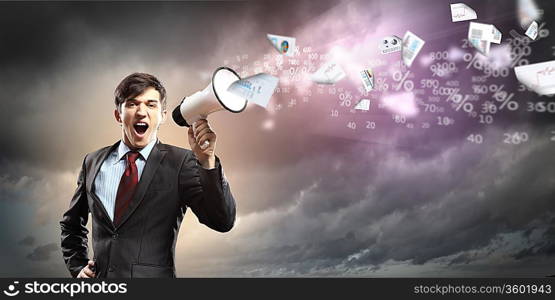 young businessman in black suit screaming into megaphone