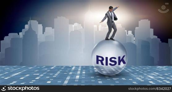 Young businessman in business risk and uncertainty concept. The young businessman in business risk and uncertainty concept