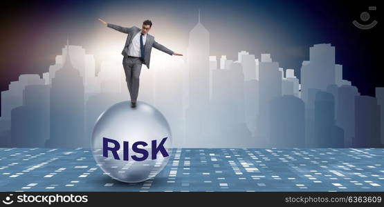 Young businessman in business risk and uncertainty concept