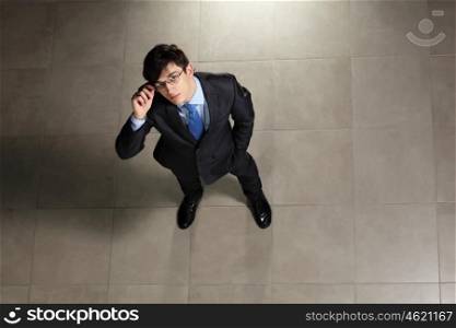 Young businessman in glasses. Image of young businessman in glasses. Top view