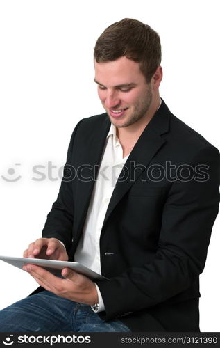 Young Businessman in jeans working on a tablet pc