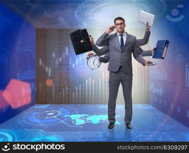 Young businessman in multitasking concept