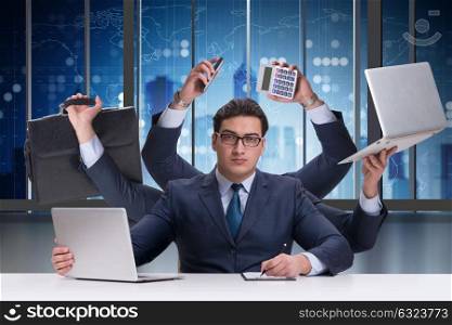 Young businessman in multitasking concept