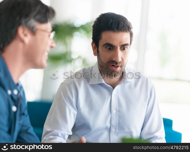 Young businessman in office with collegues