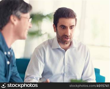 Young businessman in office with collegues