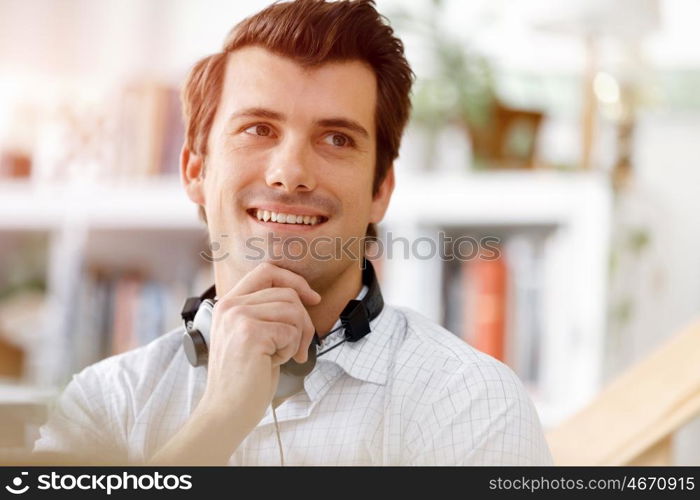 Young businessman in office. Young businessman working in office