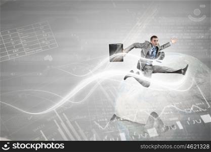 Young businessman in suit running at full pelt. Full speed businessman