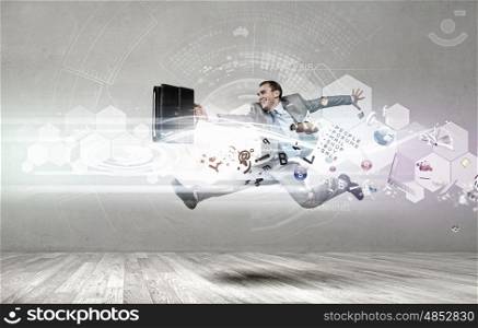Young businessman in suit running in a hurry. Full speed businessman