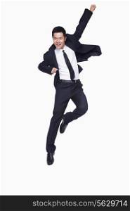 Young businessman jumping