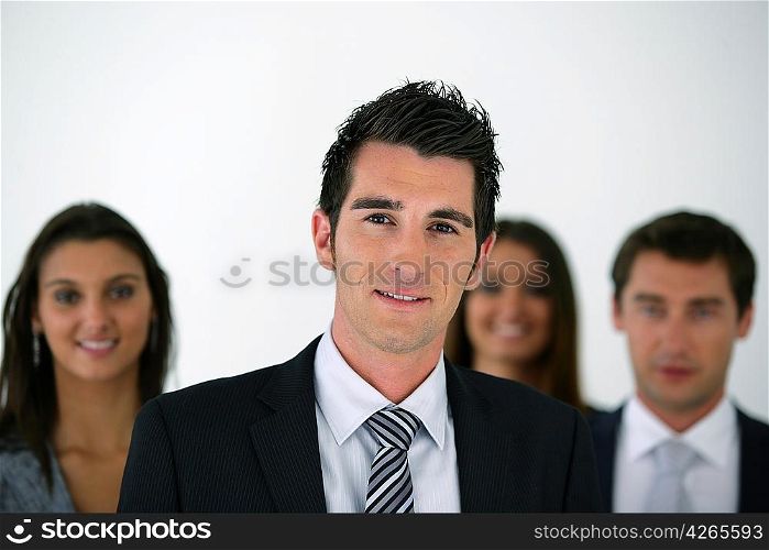 young businessman leading a team