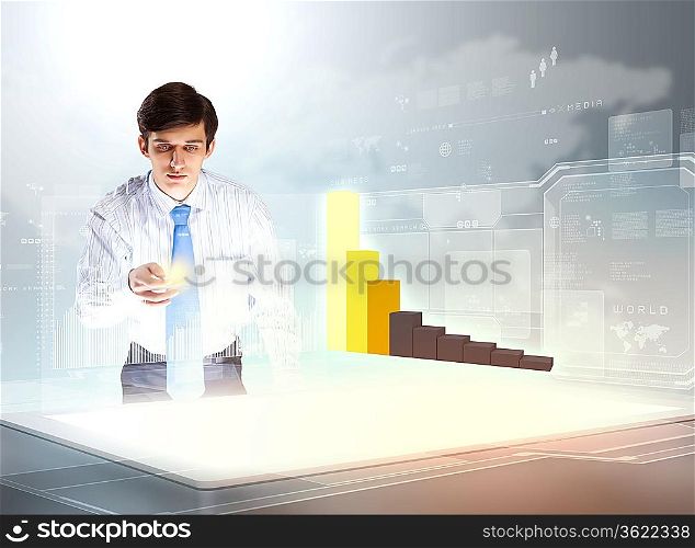 young businessman looking at graph of high-tech image