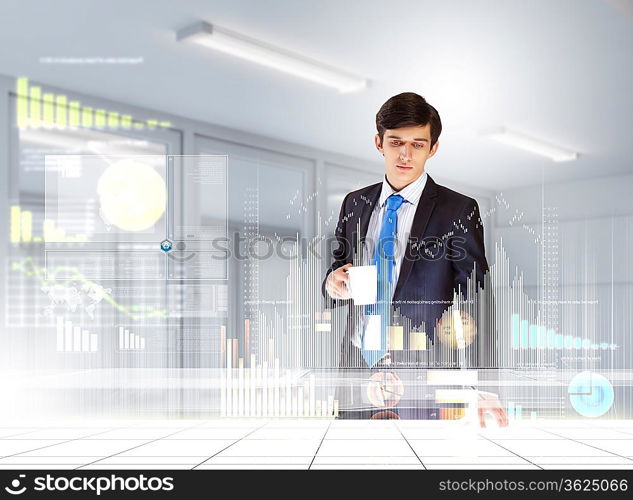 young businessman looking at graph of high-tech image