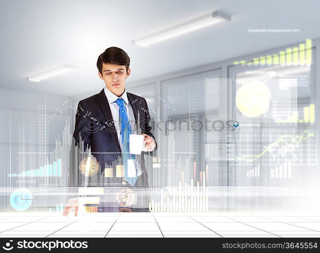 young businessman looking at graph of high-tech image