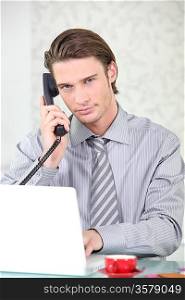young businessman making a call