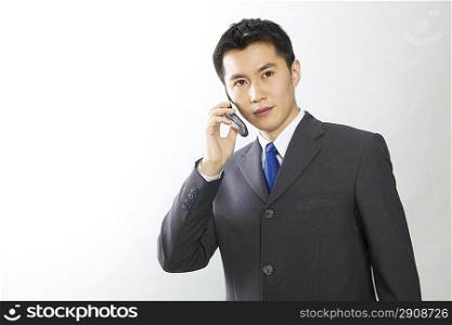 Young businessman making phone calls