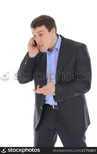 Young businessman nervously on the phone, gesturing with his hands. Isolated on white background