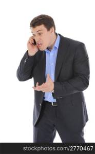 Young businessman nervously on the phone, gesturing with his hands. Isolated on white background