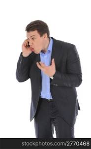 Young businessman nervously on the phone. Isolated on white background