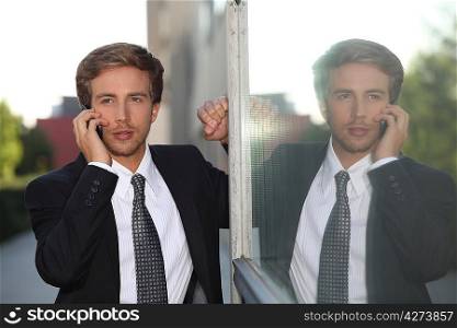 Young businessman on mobile phone
