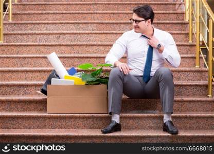Young businessman on the street after dismissal