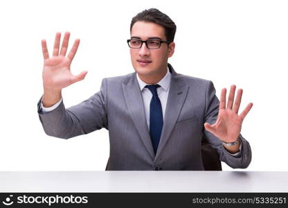 Young businessman pressing virtual buttons isolated on white bac. Young businessman pressing virtual buttons isolated on white background