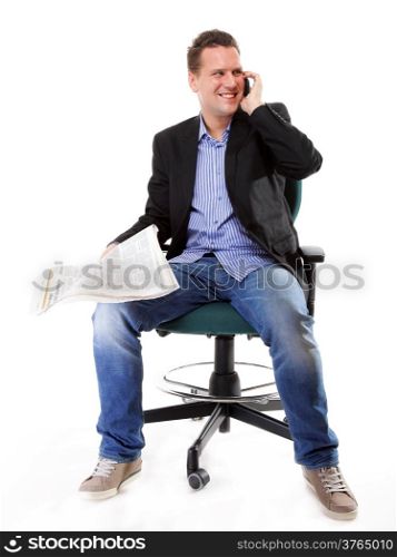 young businessman reads newspaper while phoning job seeking white background